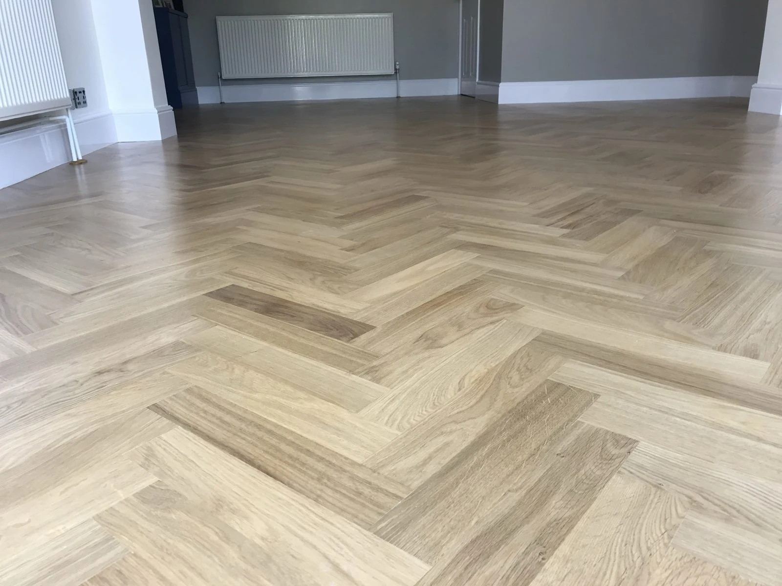 Close-up of herringbone oak parquet pattern in Bristol