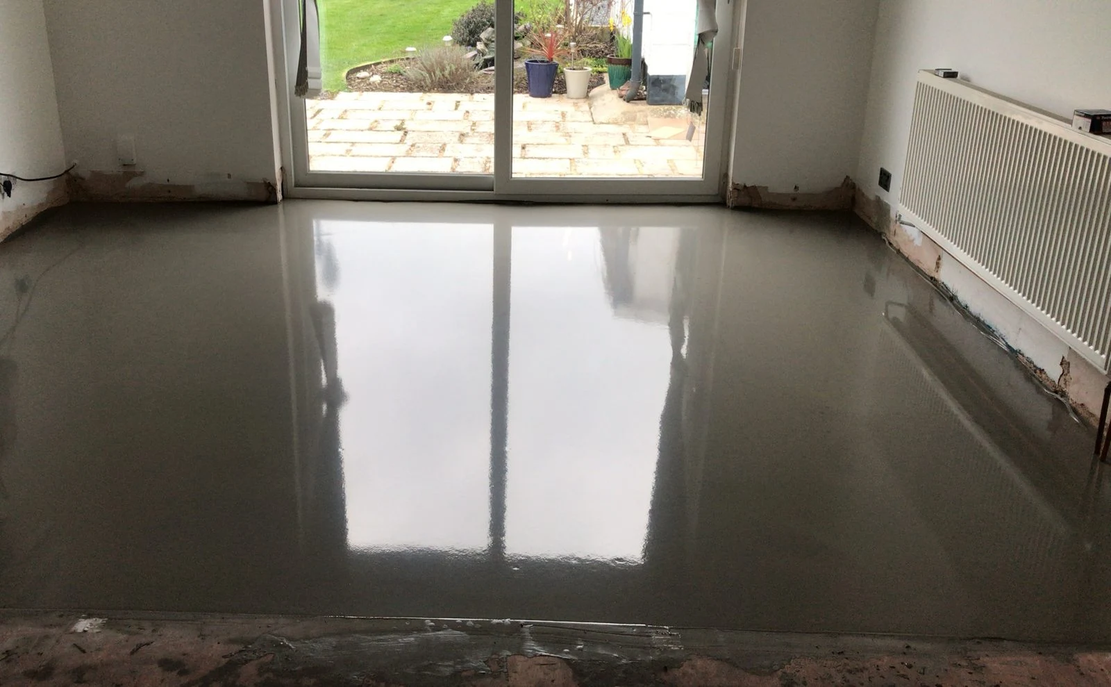 Self-levelling screed poured before laying parquet in Bristol