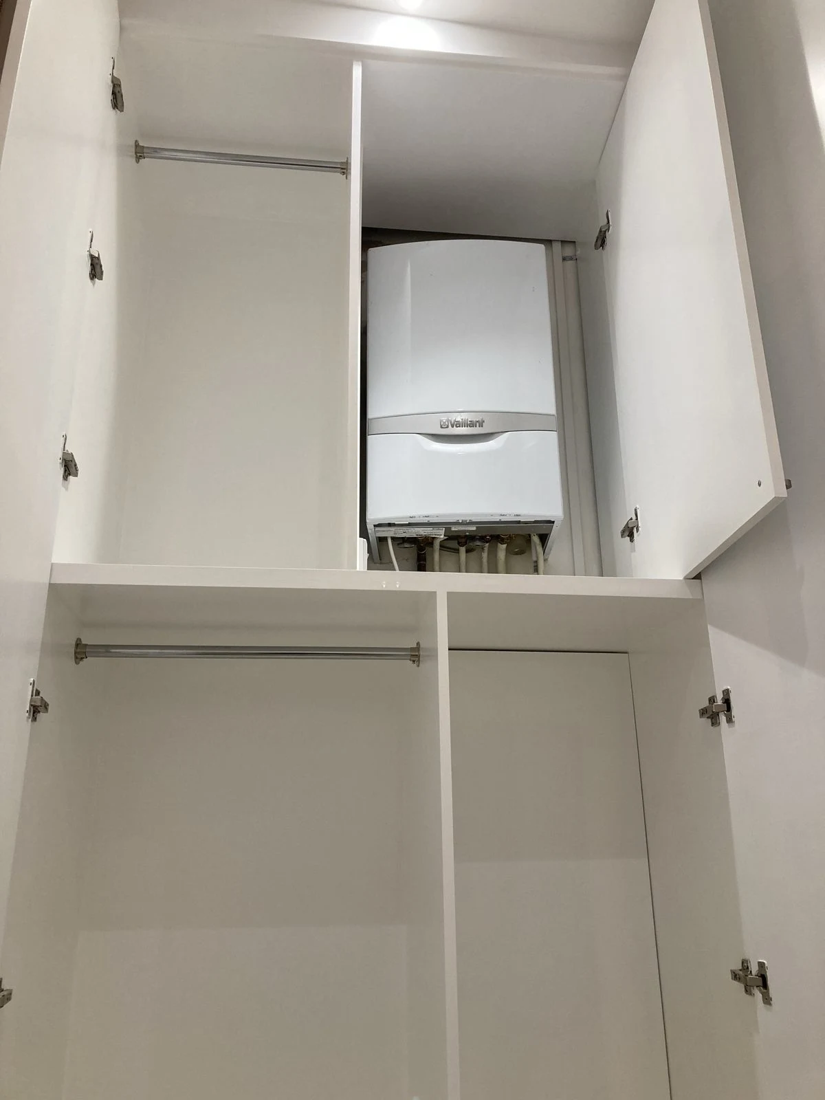 Fitted wardrobe with a boiler neatly hidden inside